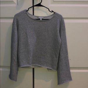 Grey long sleeve crop with open sleeves.